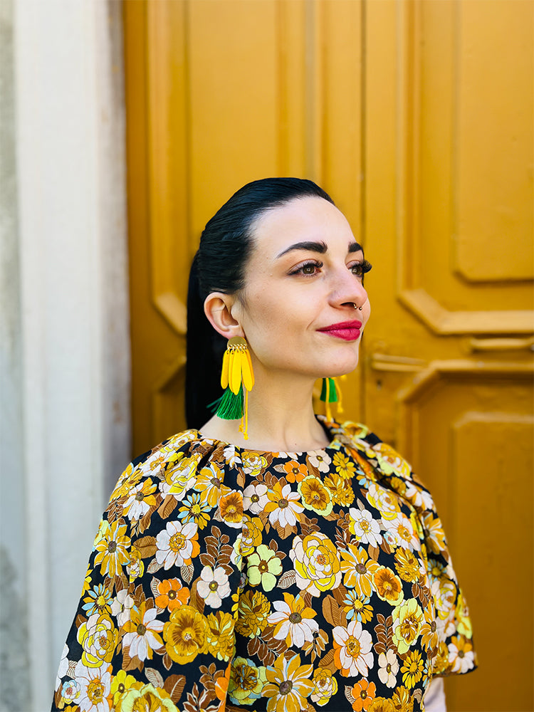 Daisy Daze | Yellow – A standout pair of handmade earrings ideal for lovers of vibrant, nature-inspired jewellery - photo model - Italy 