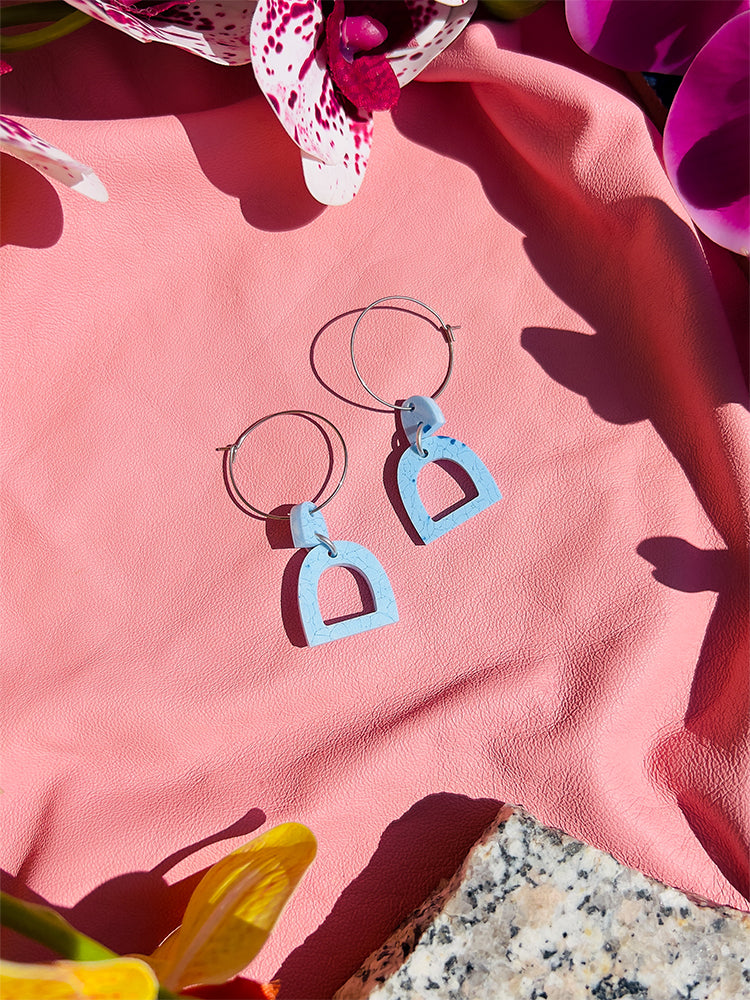 Pompei | Mini Hoop | Sky Blue – Stunning earrings with a light blue hue, adding a touch of Italian elegance to your spring and summer wardrobe - styled shot