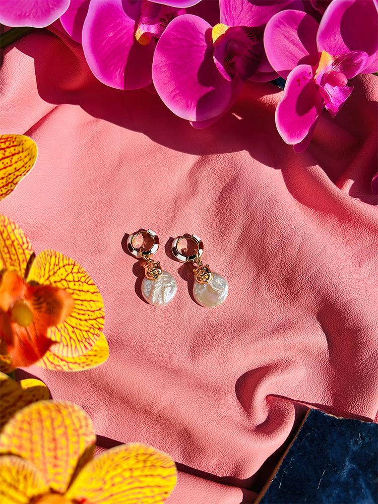 Puma Pearl | Huggie Hoop Earrings, featuring a puma charm and an irregular pearl, perfect for making a statement on your wedding day with unique handmade jewellery - styled shot