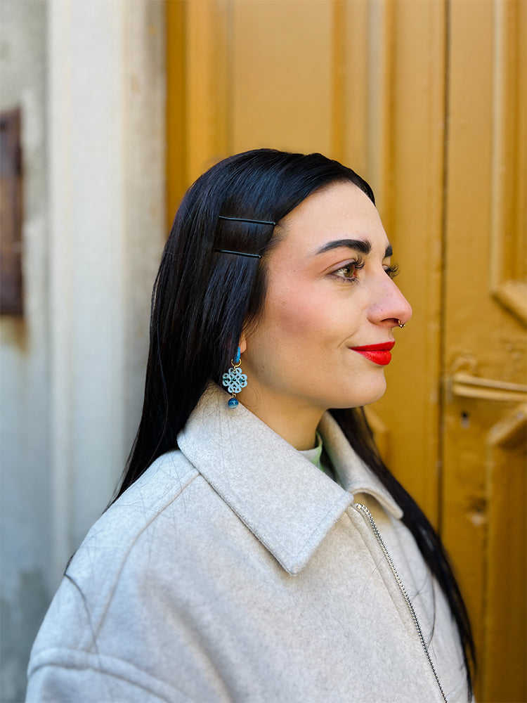 Mini Ratan Hoops Blue – colourful handmade earrings adding charm to any outfit - Side view of model in Italy