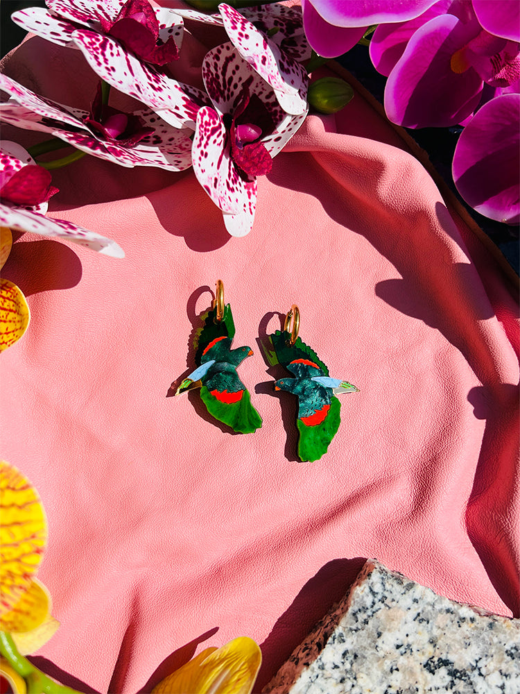 red winged parrot - Beautifully crafted earrings, blending modern design with nature-inspired elegance for the perfect accessory - styled shot