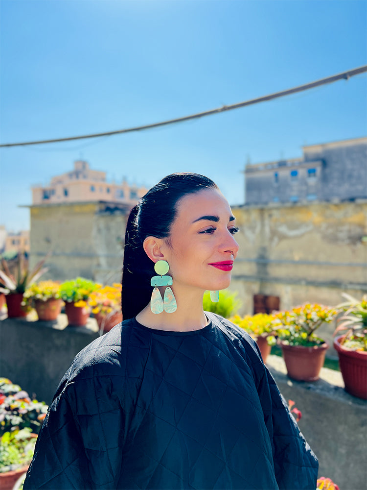 Sophia | Statement Abstract | Turquoise Marble earrings: unique handmade earrings with a striking combination of turquoise marble and abstract shapes, perfect for those seeking vibrant, eye-catching jewellery - photo model - Italy 