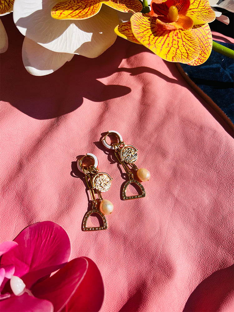 The Stirrup Pearl Hoop earrings, a stunning piece of handmade jewellery with a pop of colour, perfect for adding charm to your style - styled photo