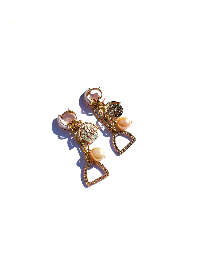 The Stirrup Pearl Hoop earrings, featuring handmade craftsmanship and vibrant details, ideal for those looking for unique charm earrings - top view